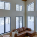 Mystical Bluff Cozy cottage interior with expansive windows revealing a snowy landscape, symbolizing winter preparedness by Jayne's Luxury Rentals