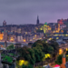 Dusk over Edinburgh with historic architecture illuminated, as featured in the Scottish Sunday Paper highlighting Jayne's Luxury Rentals
