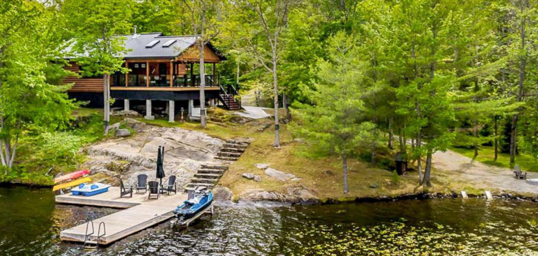 Bear's Den Cottage in Port Severn - Jayne's Luxurious Rentals | Nestled in lush greenery with private dock and watercrafts