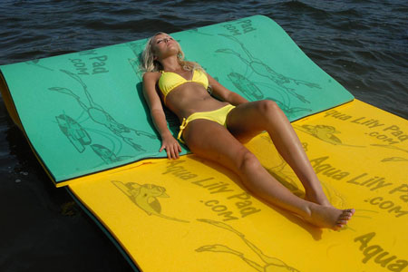 Guests enjoying leisure time on a floating Lily Pad available for rent at Jayne's Luxurious Rentals