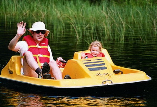 Bright Yellow Pedal Boat Ready for Guests at Jayne's Luxurious Rentals | Enjoy lakeside leisure with our pedal boat service