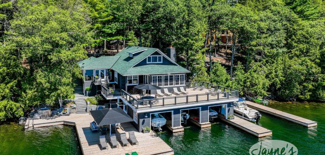 Aerial view of Luxury Lake Joe Boathouse in Port Carling - Exclusive waterfront property with a spacious deck and private docking at Jayne's Luxury Rentals.
