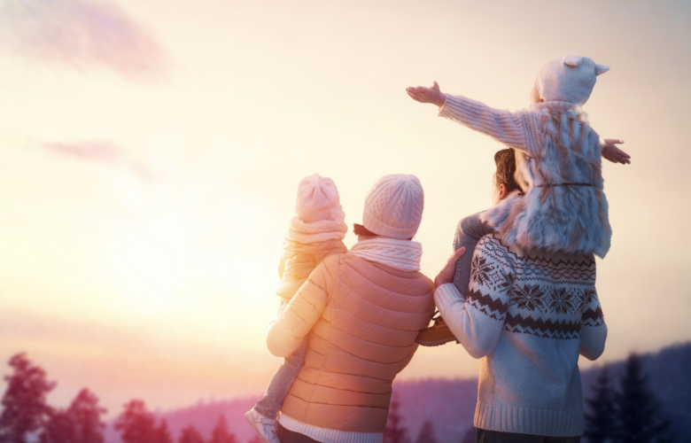 Family Enjoying a Sunset at Jayne's Luxurious Rentals | Heartwarming moment of a family basking in the glow of a winter sunset