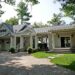 Elegant Owl's Well property in Ontario - Jayne's Luxurious Rentals | Classic design with a spacious porch and lush surroundings