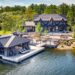 Lochside Estate at Parry Sound North Shore - Jayne's Luxurious Rentals | A sophisticated property with a boathouse and extensive outdoor living space.