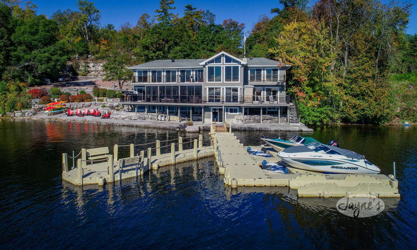 Waterfront view of Pigeon Dream in Kawartha Lakes and Haliburton County (Bobcaygeon) - Jayne's Luxurious Rentals | Modern home with private docks and boats