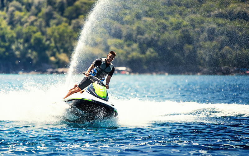 An exhilarating jet ski ride on the clear waters of Muskoka, available for guests at Jayne's Luxury Rentals