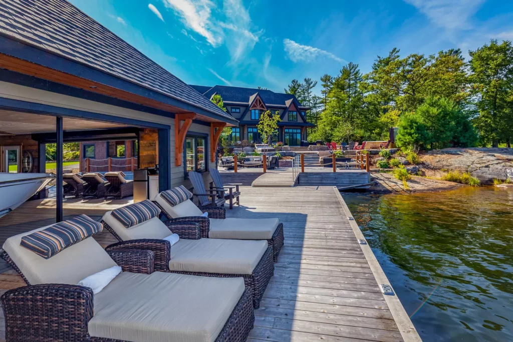 Lochside retreat by Jayne's Luxury Rentals, with a waterfront deck and lush surroundings.