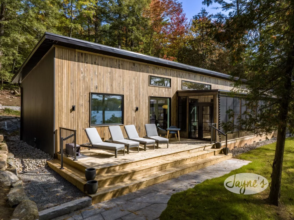 Modern lakeside retreat at Magical Decades, offering a serene getaway in Jayne's Luxury Rentals collection.