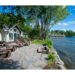 Lakeside stone patio at Claire De Loon with seating - Matthew & Kate reminisce on privacy and location - Jayne's Luxury Rentals