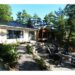 Y'Ol Point cottage with stone patio in forest setting - Damir's recurring positive rental experience - Jayne's Luxury Rentals.